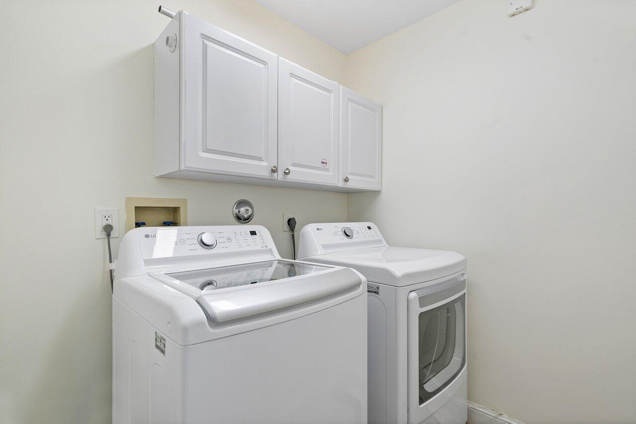 9547 Fox Trot Lane Boca Raton, FL 33496 - Photo 19 of 38 a utility room with dryer and washer