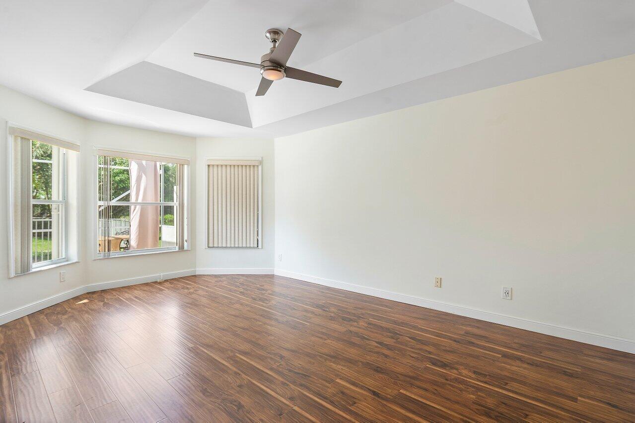 9547 Fox Trot Lane Boca Raton, FL 33496 - Photo 20 of 38 wooden floor in an empty room with a window