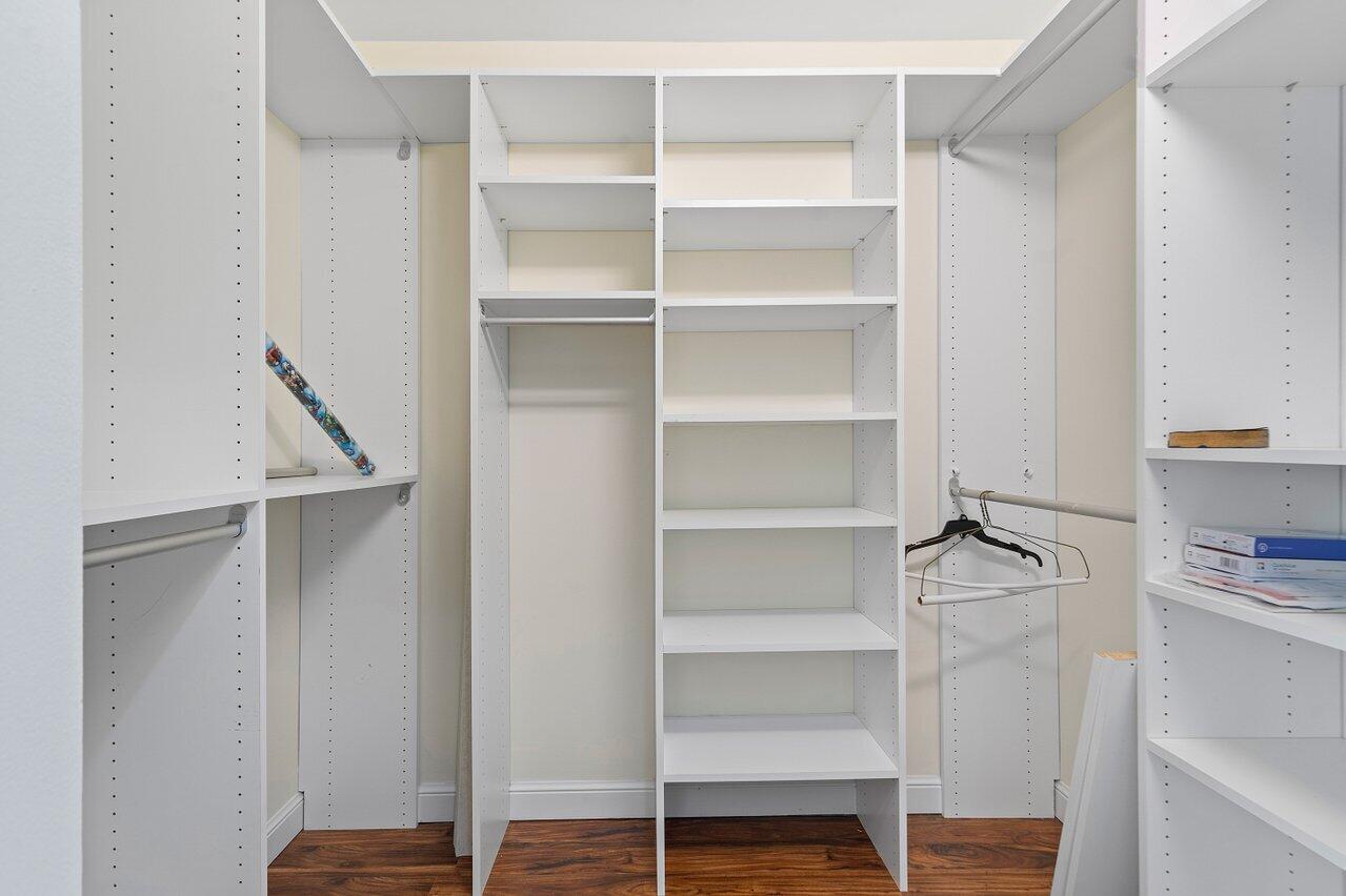 9547 Fox Trot Lane Boca Raton, FL 33496 - Photo 22 of 38 a view of walk in closet with empty racks