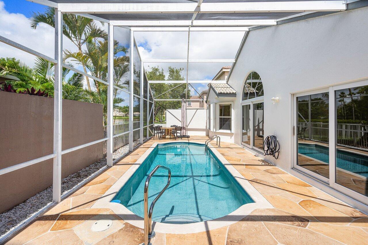 9547 Fox Trot Lane Boca Raton, FL 33496 - Photo 26 of 38 a view of a house with a swimming pool