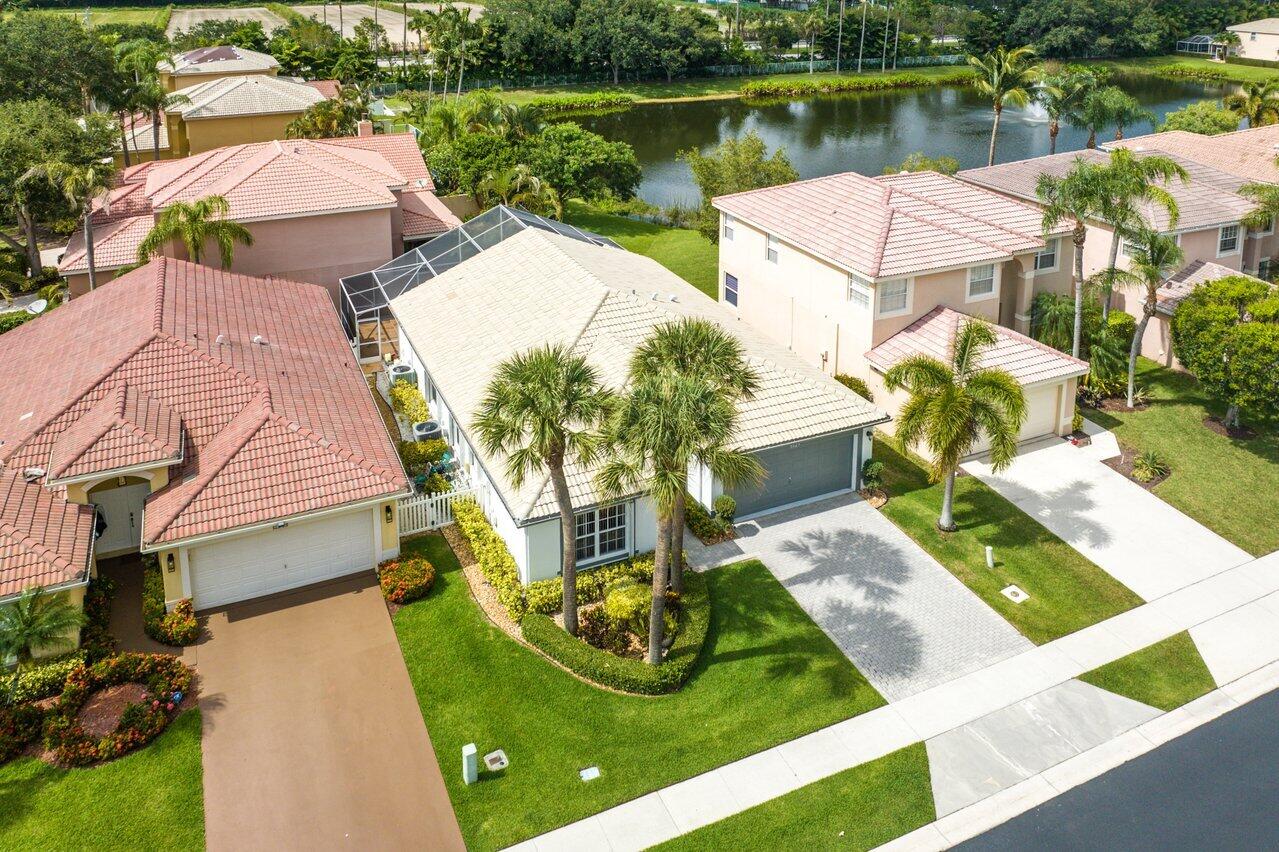 9547 Fox Trot Lane Boca Raton, FL 33496 - Photo 33 of 38 a view of a lake with a yard and large trees