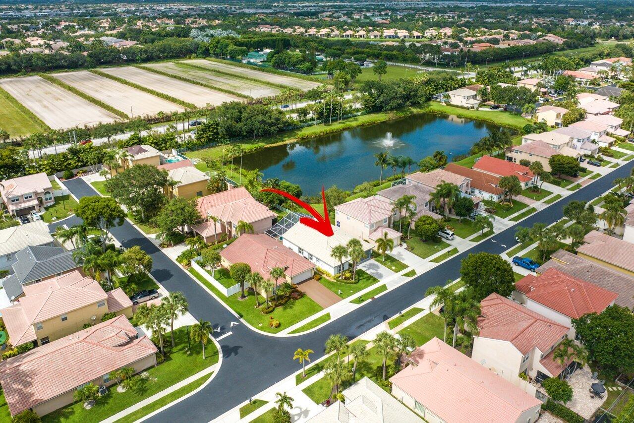 9547 Fox Trot Lane Boca Raton, FL 33496 - Photo 34 of 38 an aerial view of residential houses with outdoor space and lake view
