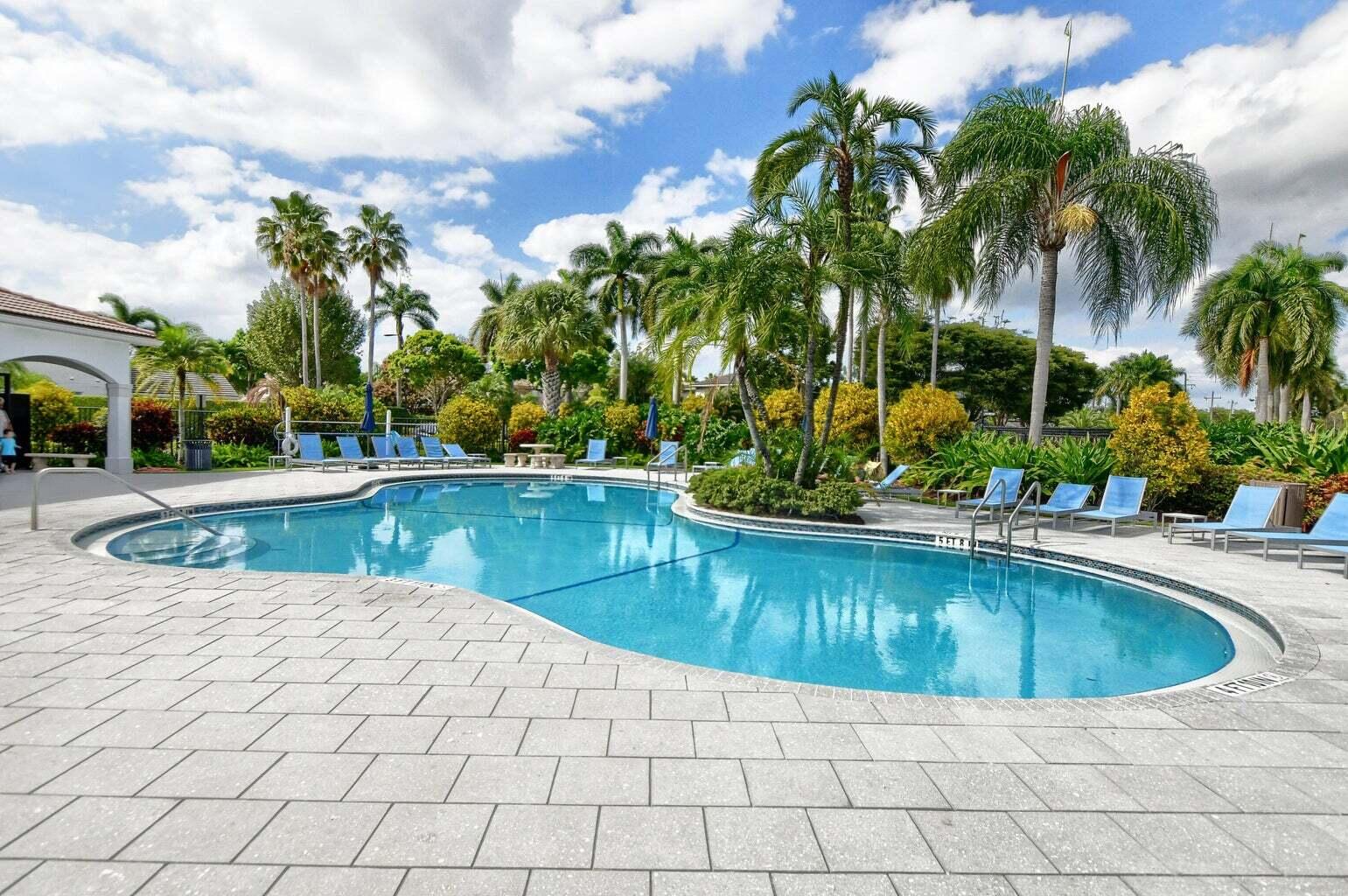 9547 Fox Trot Lane Boca Raton, FL 33496 - Photo 37 of 38 a view of a swimming pool and a chair