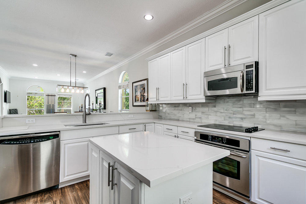 111 Via Poinciana Street Boca Raton, FL 33487 - Photo 5 of 38 OPEN WHITE KITCHEN
