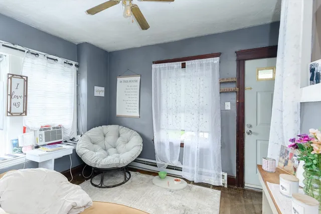 a living room with furniture and flowers