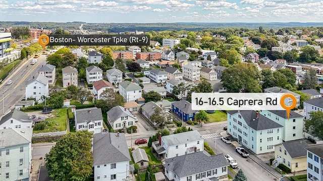 an aerial view of residential building and lake