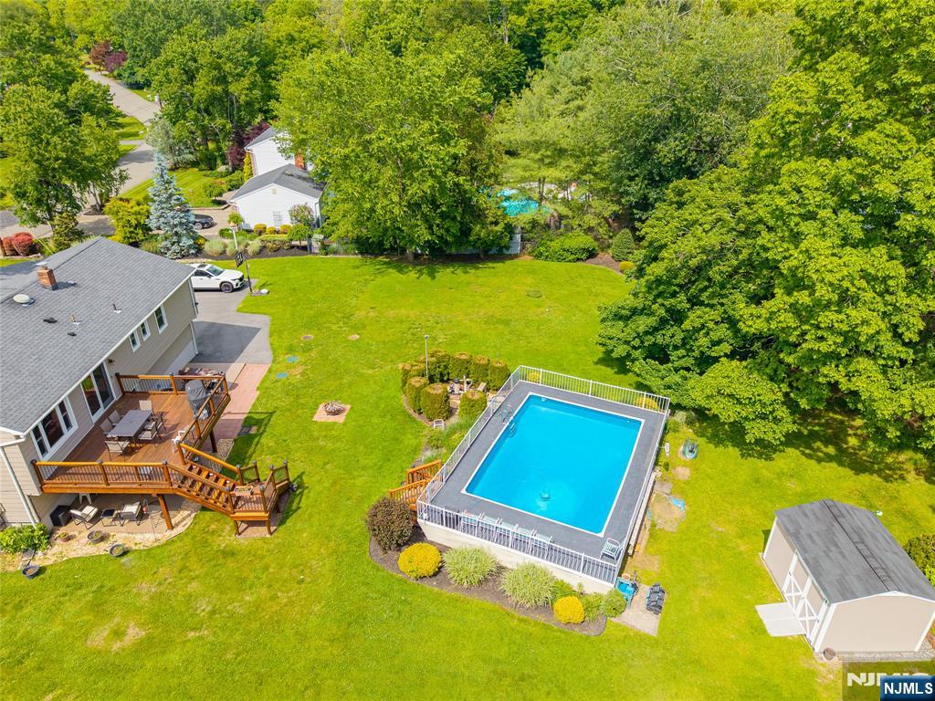 55 Marcia Road Ringwood, NJ 07456 - Photo 5 of 42 an aerial view of a pool patio swimming pool and outdoor seating