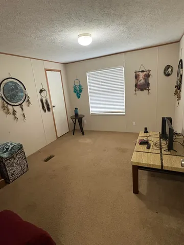 a view of livingroom with furniture and window