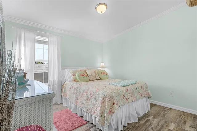 a bedroom with a bed and with furniture