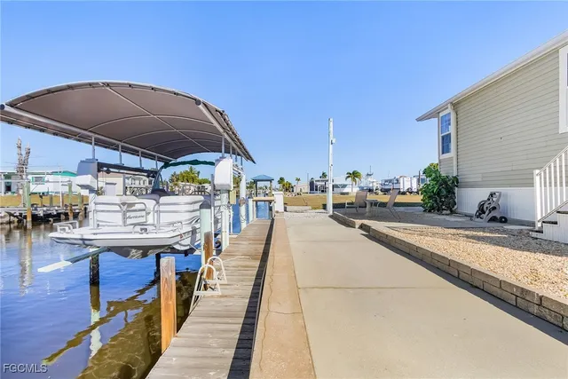 a view of a swimming pool with sitting area