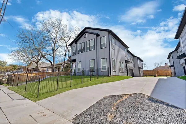 a view of a house next to a yard