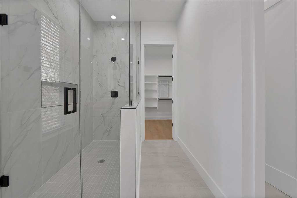 308 East 7th Street Dallas, TX 75203 - Photo 33 of 33 a bathroom with a shower and a glass door