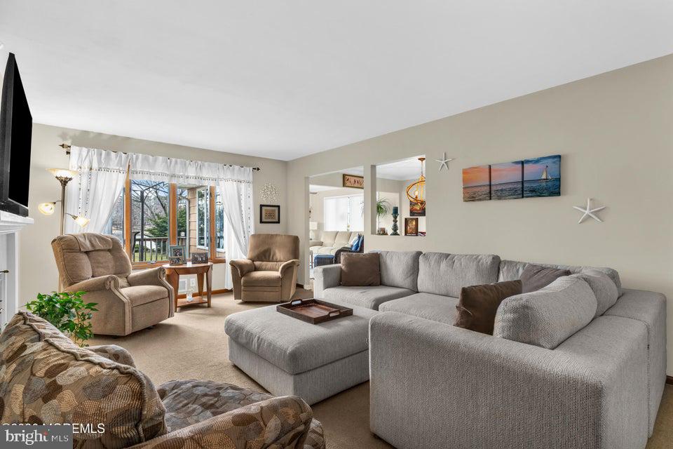 535 Carroll Fox Road Brick, NJ 08724 - Photo 8 of 31 a living room with furniture and a flat screen tv
