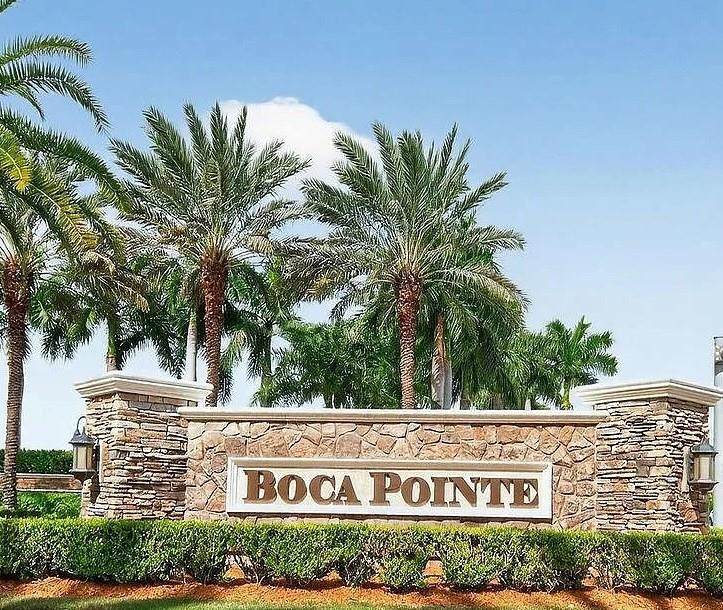 7520 La Paz Boulevard, Unit 306 Boca Raton, FL 33433 - Photo 36 of 36 a view of outdoor space with signage and flags