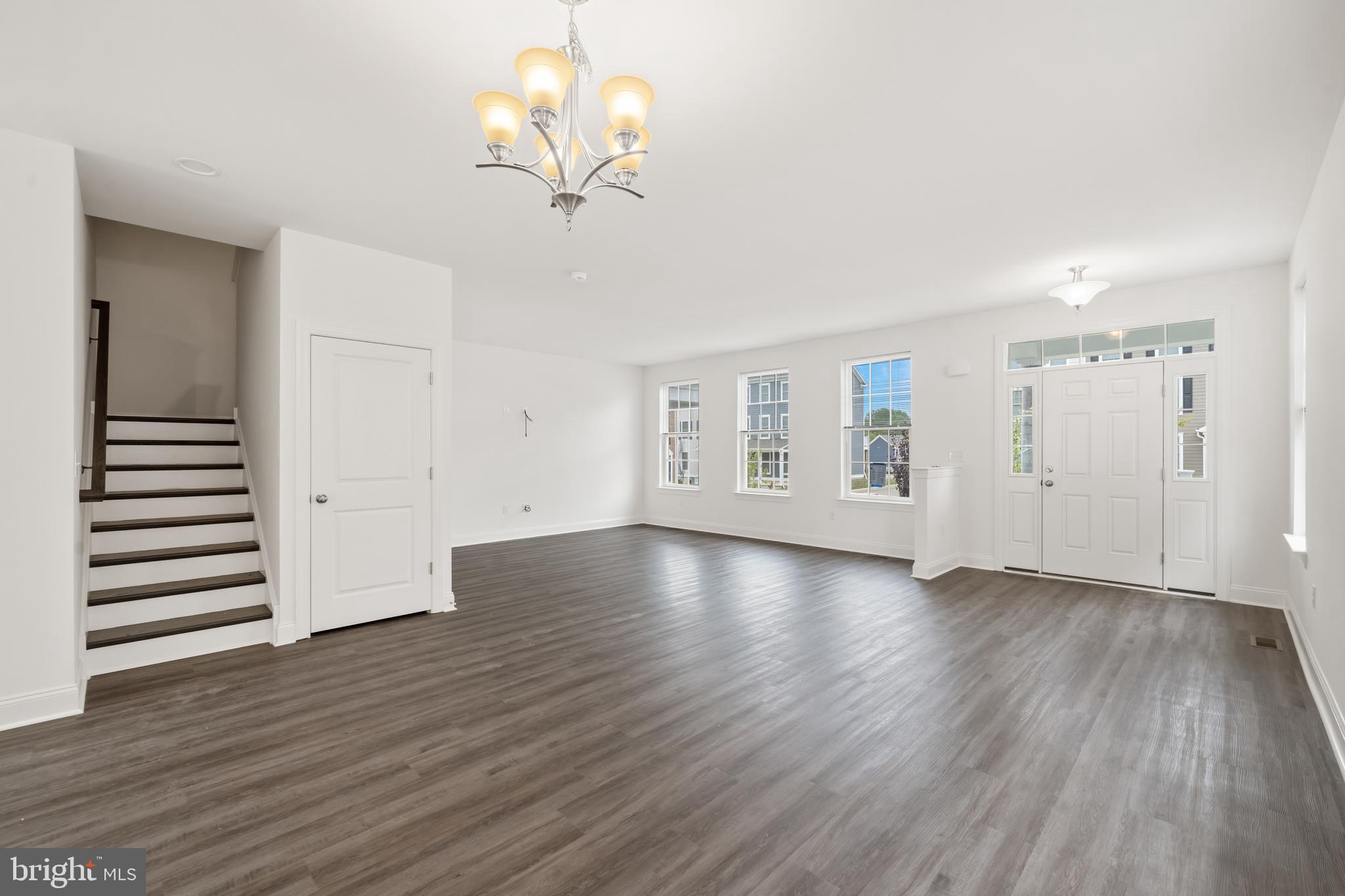 845 Mapleton Avenue Middletown, DE 19709 - Photo 16 of 30 an empty room with wooden floor and windows