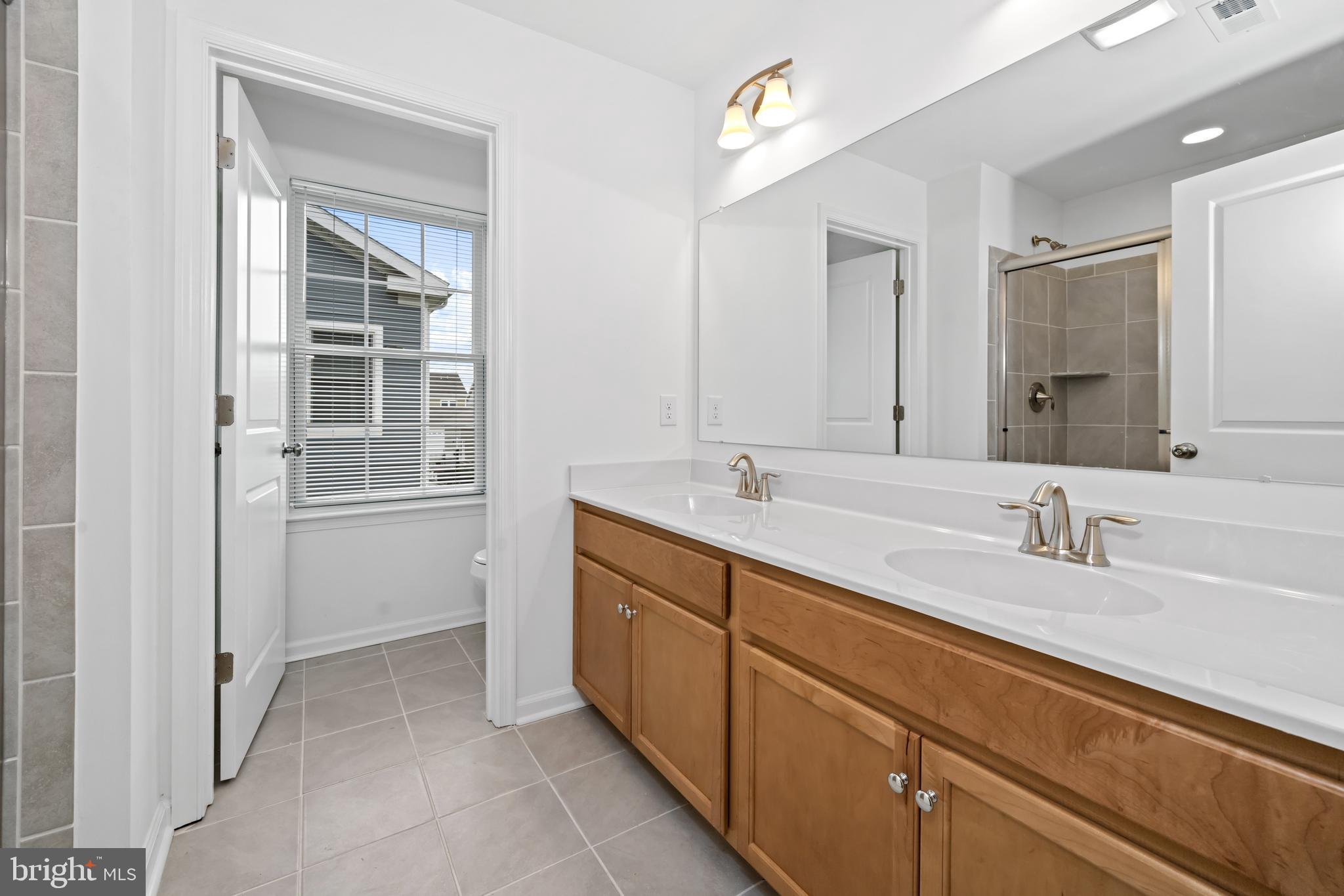 845 Mapleton Avenue Middletown, DE 19709 - Photo 20 of 30 a spacious bathroom with double sink and a mirror