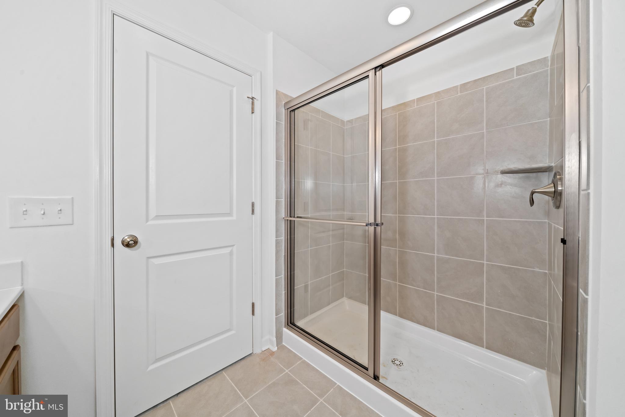 845 Mapleton Avenue Middletown, DE 19709 - Photo 21 of 30 a bathroom with a glass shower door