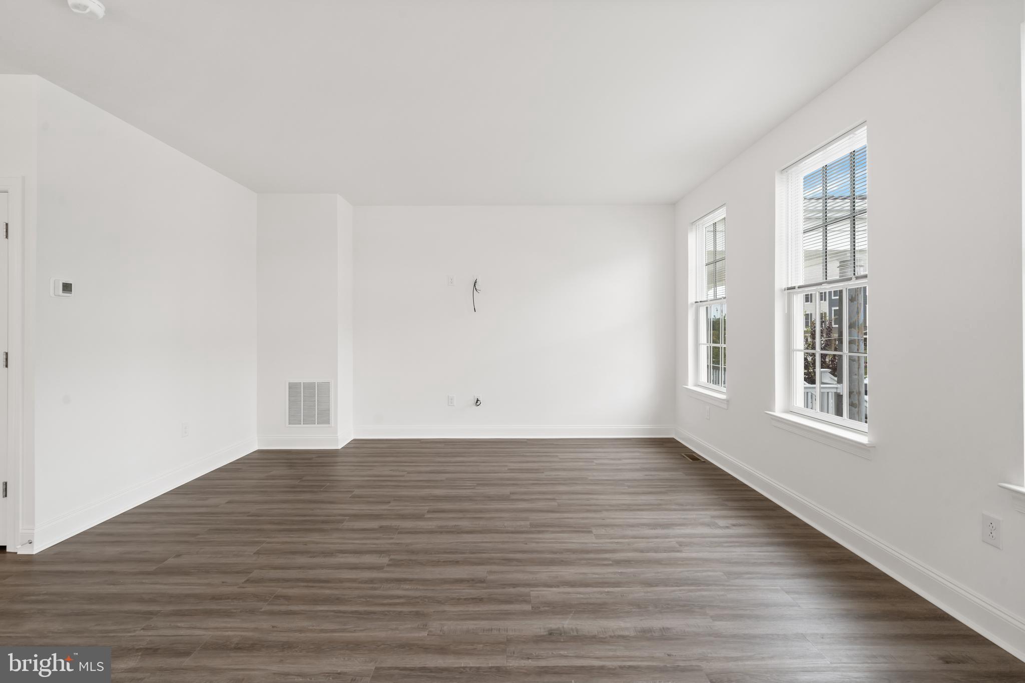 845 Mapleton Avenue Middletown, DE 19709 - Photo 25 of 30 a view of an empty room with wooden floor and a window