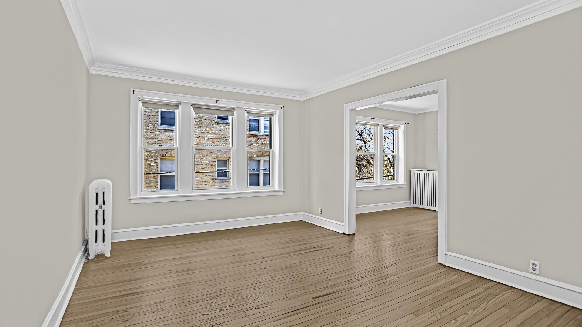 532 Sheridan Road, Unit 2B Evanston, IL 60202 - Photo 2 of 16 wooden floor in an empty room with a window