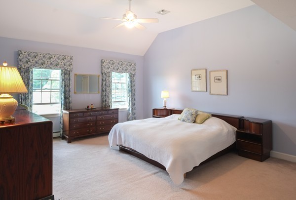 45 York Road Wayland, MA 01778 - Photo 17 of 30 a bedroom with a bed and a chandelier
