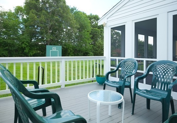 45 York Road Wayland, MA 01778 - Photo 26 of 30 a view of a chair and table in the balcony