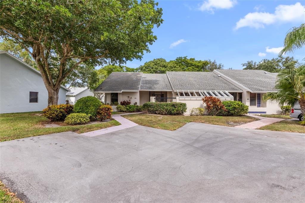 10971 Lake Front Place, Unit 10971 Boca Raton, FL 33498 - Photo 1 of 33 a view of house with outdoor space and street view