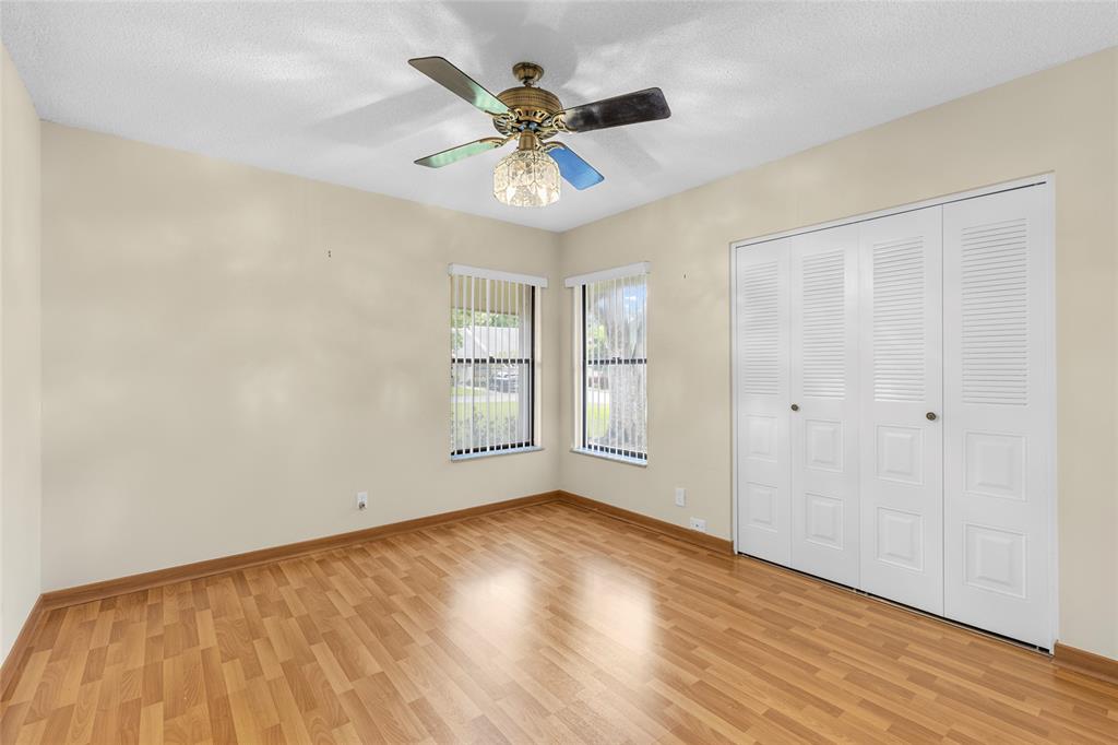 10971 Lake Front Place, Unit 10971 Boca Raton, FL 33498 - Photo 17 of 33 wooden floor in an empty room with a window