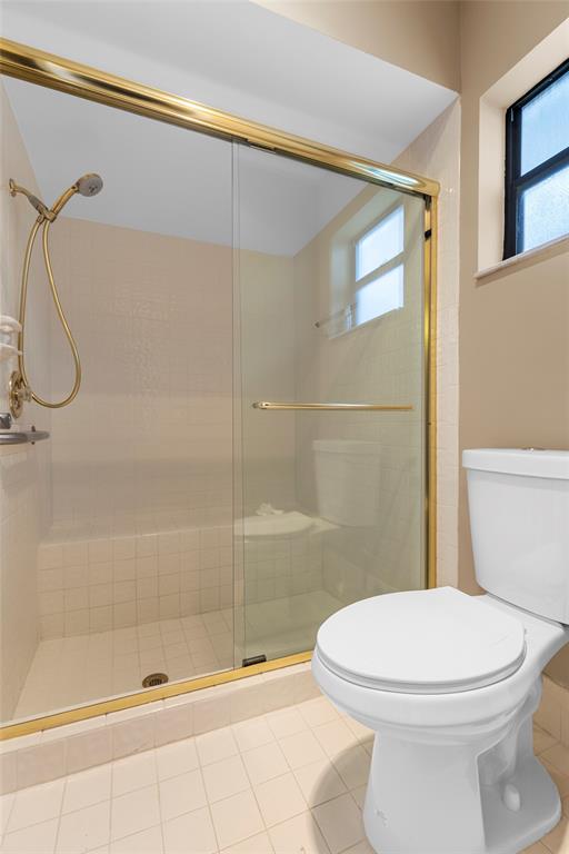 10971 Lake Front Place, Unit 10971 Boca Raton, FL 33498 - Photo 26 of 33 a bathroom with a toilet and shower