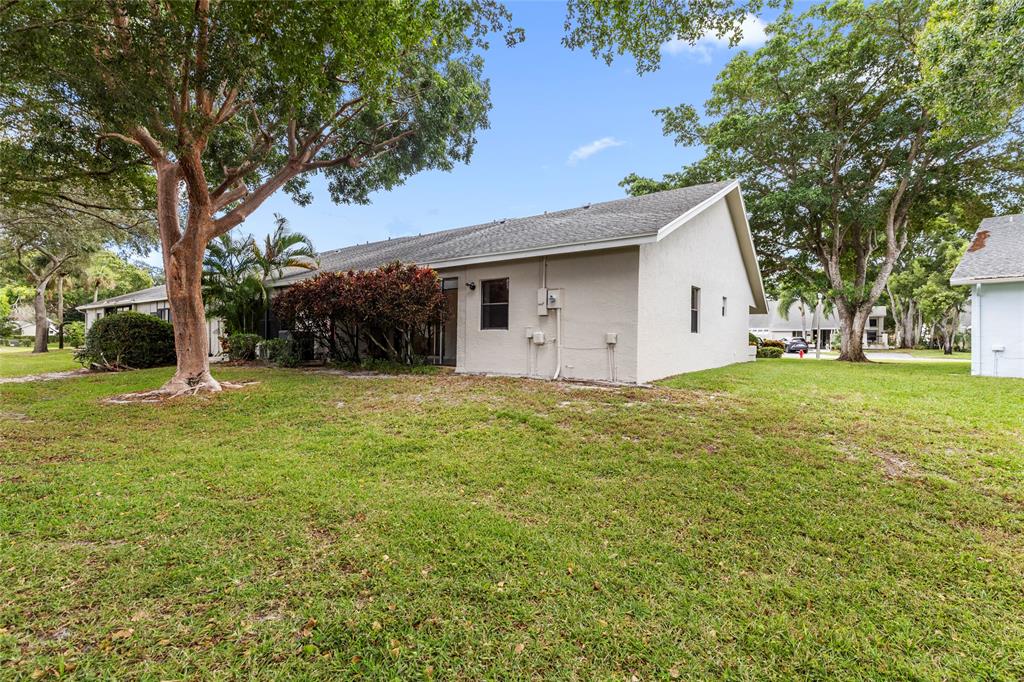 10971 Lake Front Place, Unit 10971 Boca Raton, FL 33498 - Photo 30 of 33 a view of house with backyard