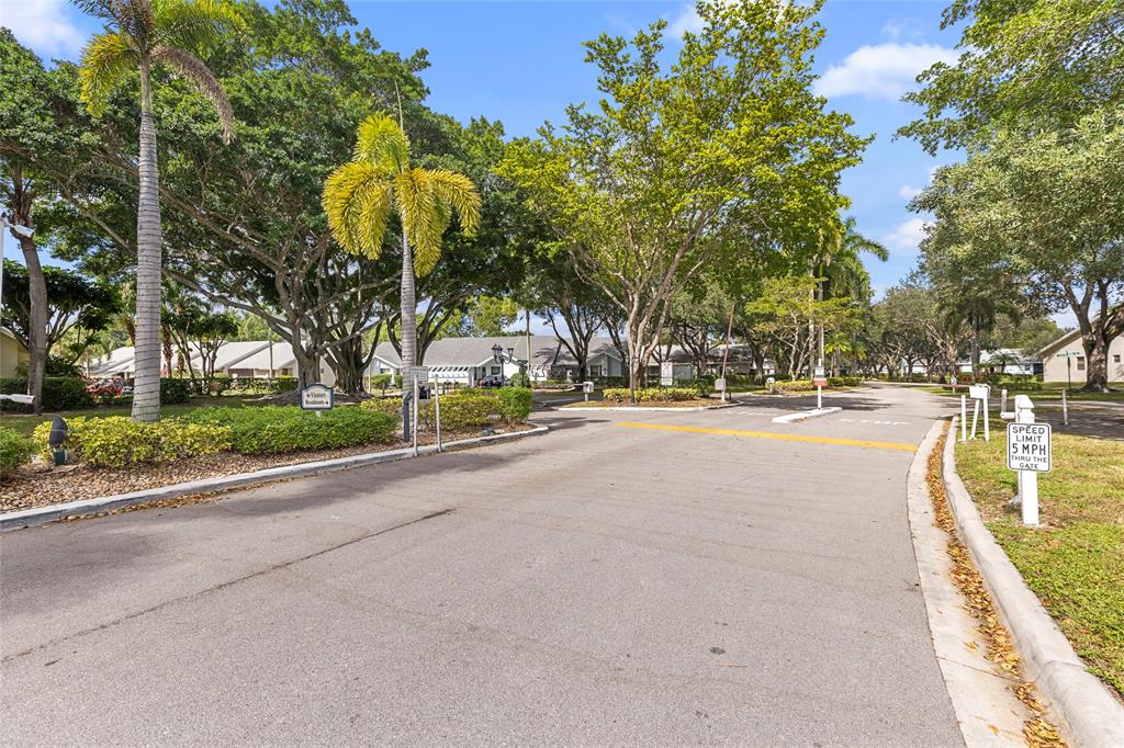 10971 Lake Front Place, Unit 10971 Boca Raton, FL 33498 - Photo 33 of 33 a view of a swimming pool with a patio