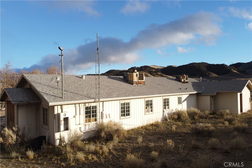 49851 Gorman Post Road Lebec, CA 93243 - Photo 37 of 42 a view of a house with a yard and potted plants