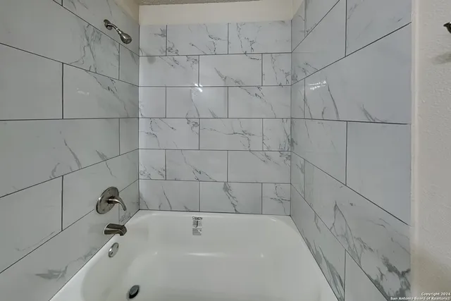 a bathroom with a bathtub