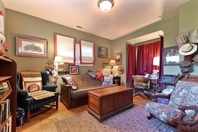 an aerial view of residential houses with outdoor space and trees
