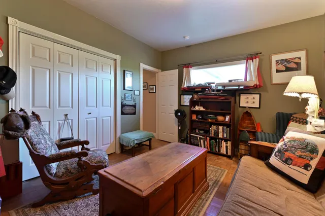 a view of a multi story residential apartment building with a yard