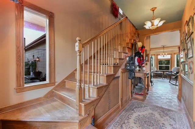 a living room filled with furniture and a chandelier