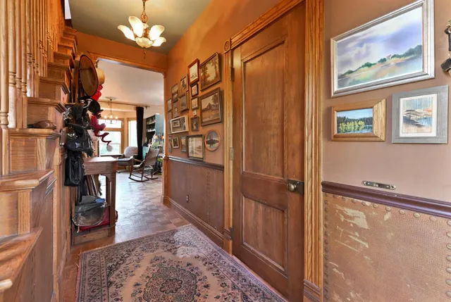 a view of a livingroom with furniture and a large window