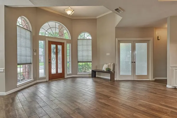 a view of a dining room with furniture wooden floor and chandelier