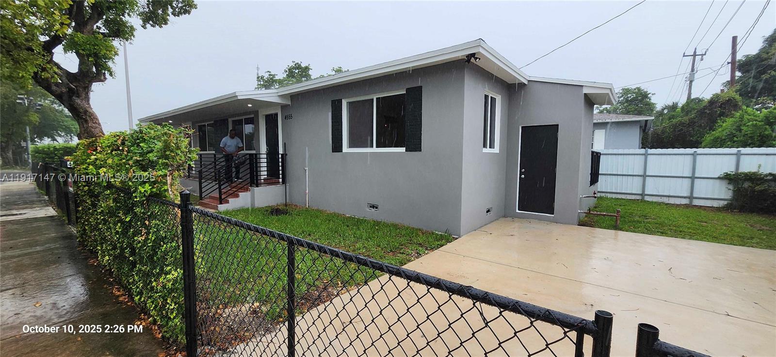 4557 Northwest 14th Avenue, Unit 4557 Miami, FL 33142 - Photo 13 of 13 a view of a house with backyard and sitting area
