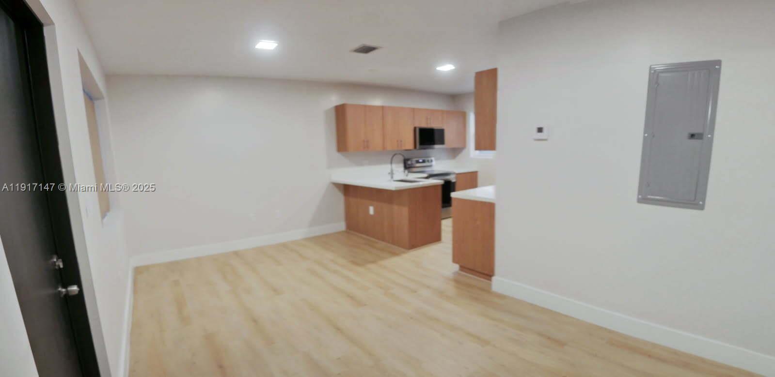 4557 Northwest 14th Avenue, Unit 4557 Miami, FL 33142 - Photo 5 of 13 en suite bathroom with a sink and a mirror