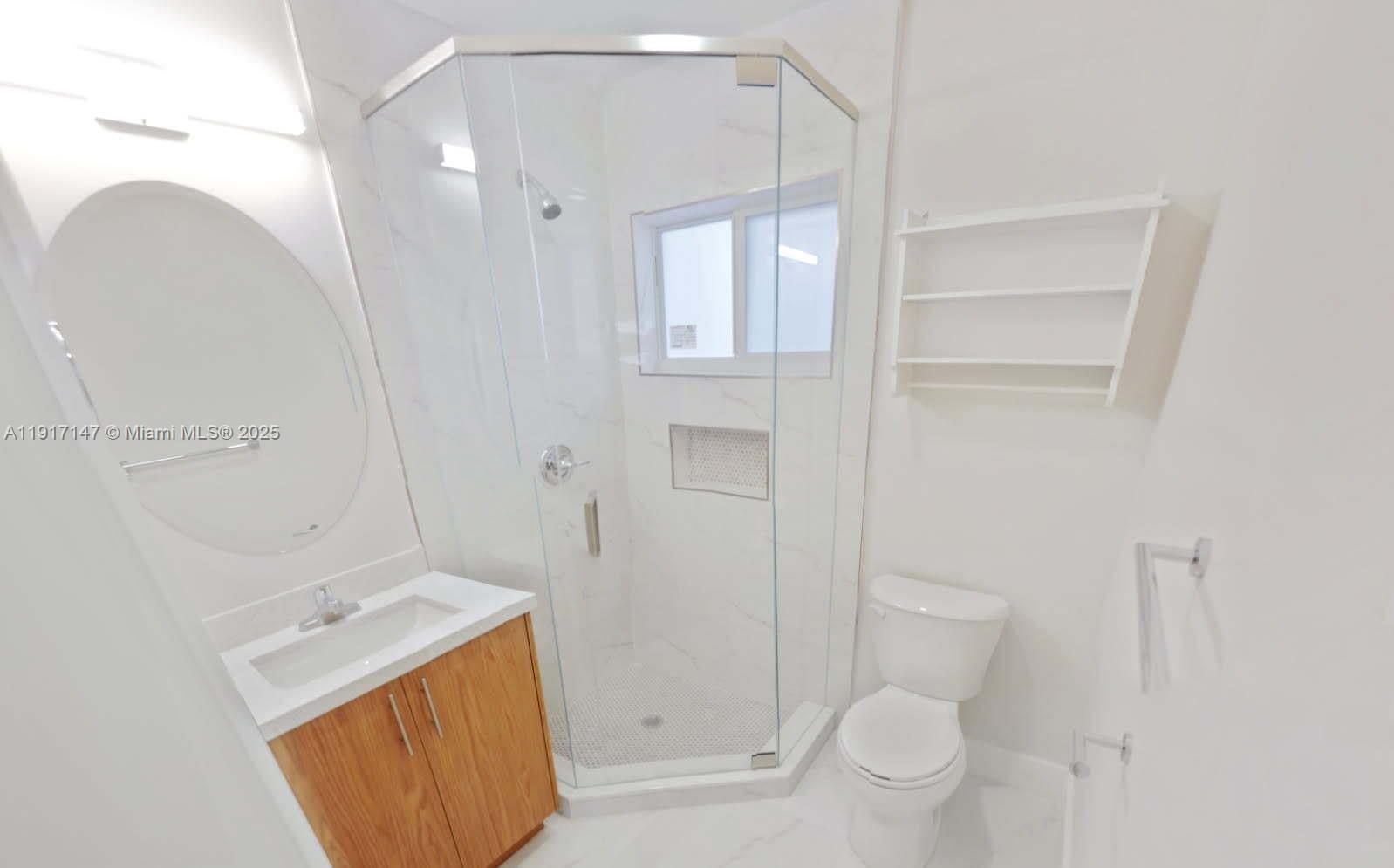 4557 Northwest 14th Avenue, Unit 4557 Miami, FL 33142 - Photo 7 of 13 a bathroom with a sink a toilet and shower