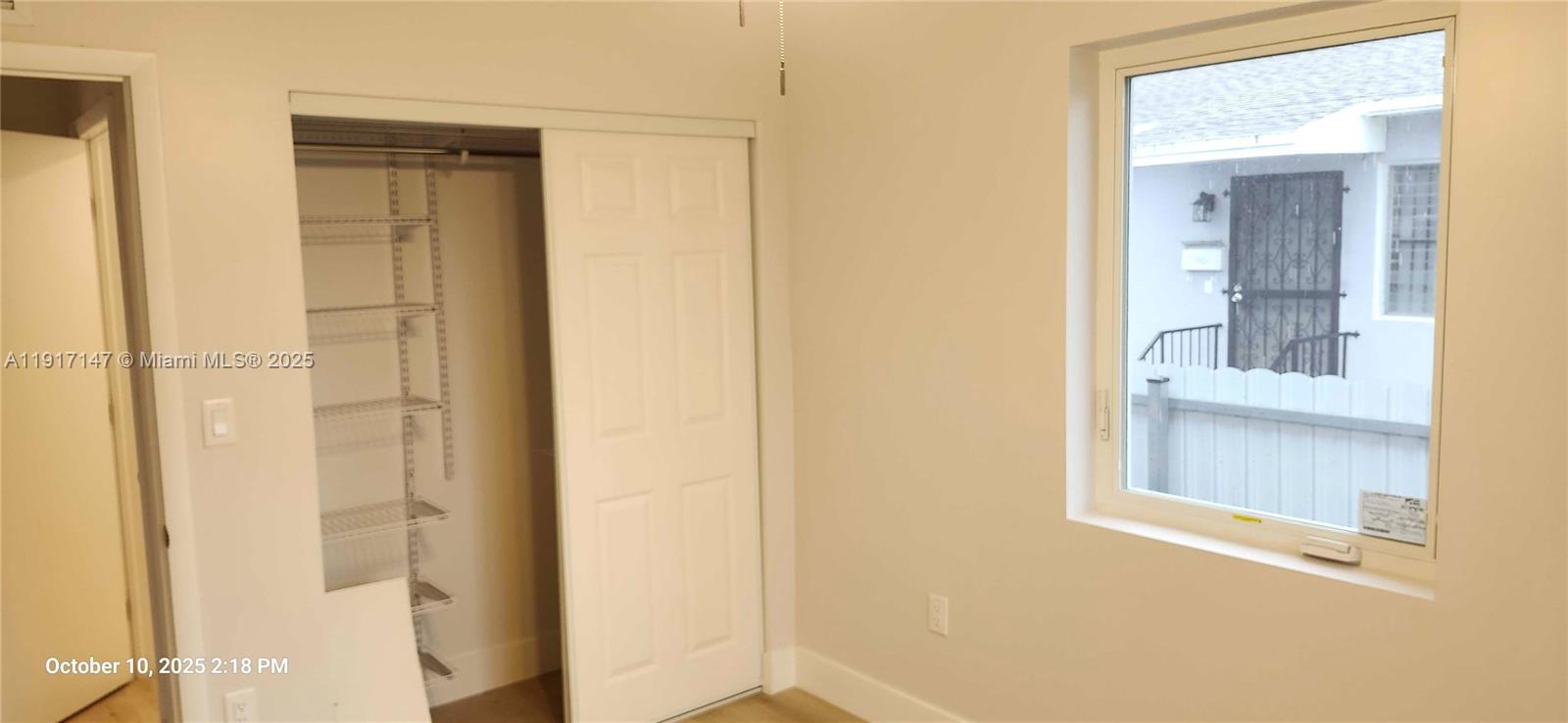 4557 Northwest 14th Avenue, Unit 4557 Miami, FL 33142 - Photo 8 of 13 a view of a bathroom from a hallway
