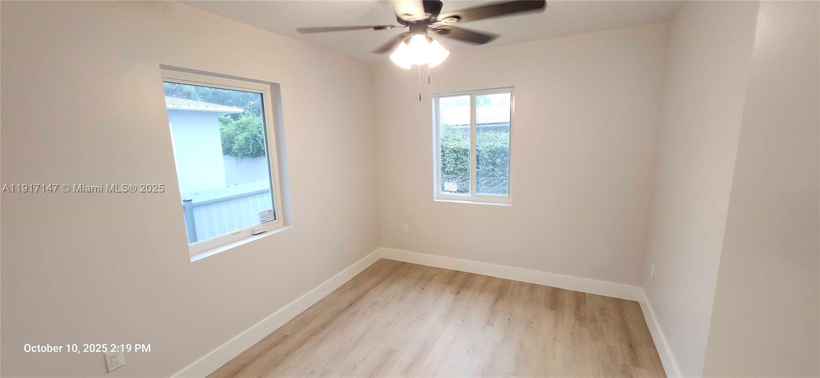 4557 Northwest 14th Avenue, Unit 4557 Miami, FL 33142 - Photo 9 of 13 an empty room with a window