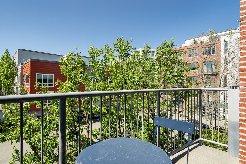 210 Broadway, Unit 301 Everett, MA 02149 - Photo 13 of 16 a view of a balcony with lake view and sitting space