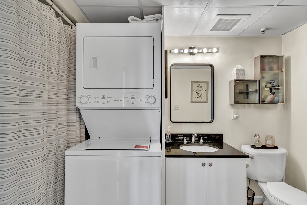 210 Broadway, Unit 301 Everett, MA 02149 - Photo 16 of 16 a utility room with dryer and washer