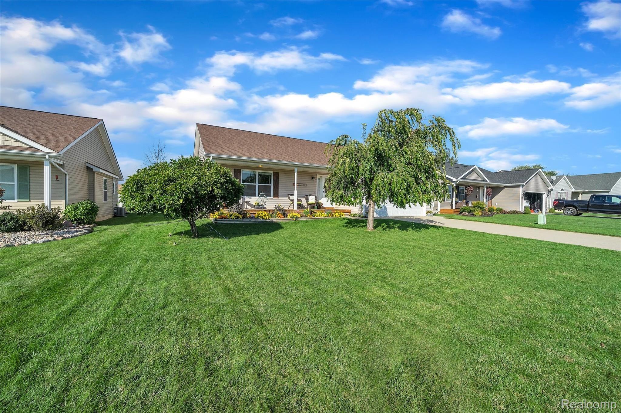 8116 Eagle Ridge Lane Fowlerville, MI 48836 - Photo 13 of 36 Front of home, Nice Lawn
