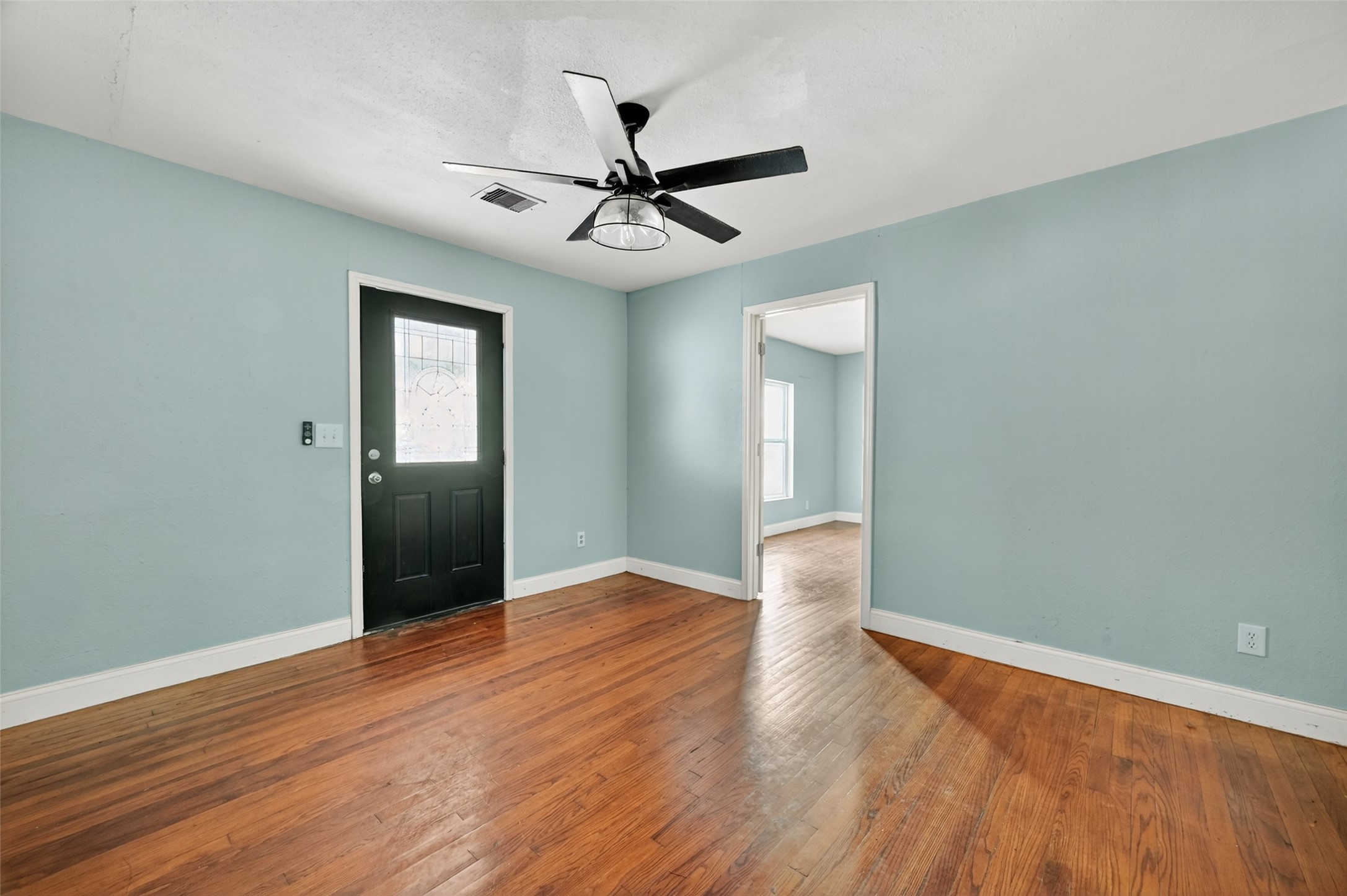 6434 Boothline Road Richmond, TX 77469 - Photo 5 of 36 wooden floor in an empty room with a window