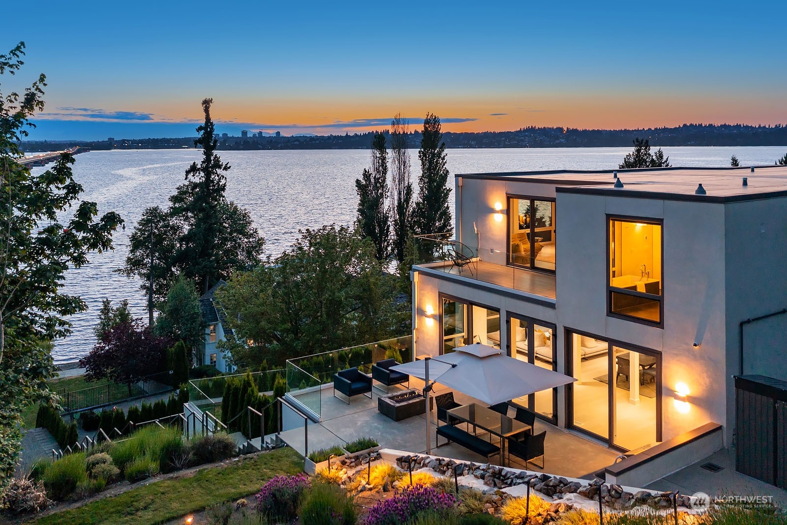 3225 Evergreen Point Road Medina, WA 98039 - Photo 1 of 34 a view of a swimming pool with a lounge chairs