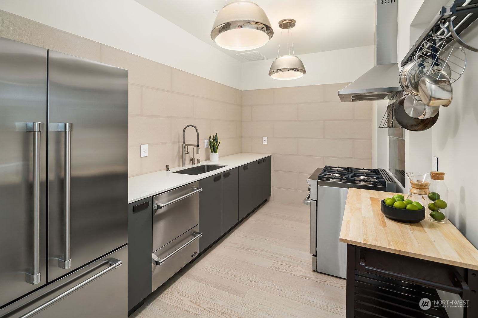 3225 Evergreen Point Road Medina, WA 98039 - Photo 11 of 34 a kitchen with stainless steel appliances granite countertop a sink and a refrigerator