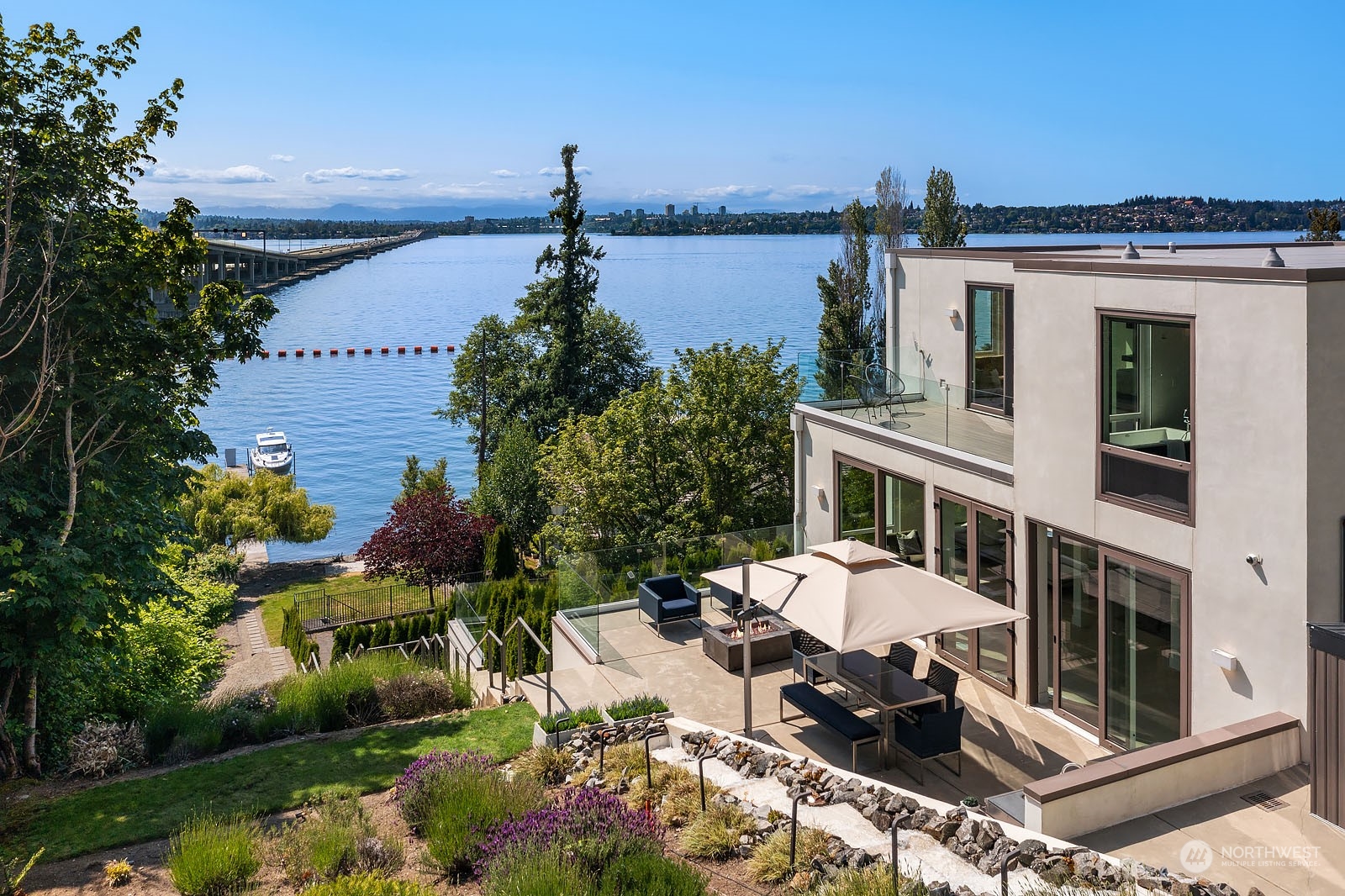 3225 Evergreen Point Road Medina, WA 98039 - Photo 12 of 34 a view of a patio with table and chairs and potted plants