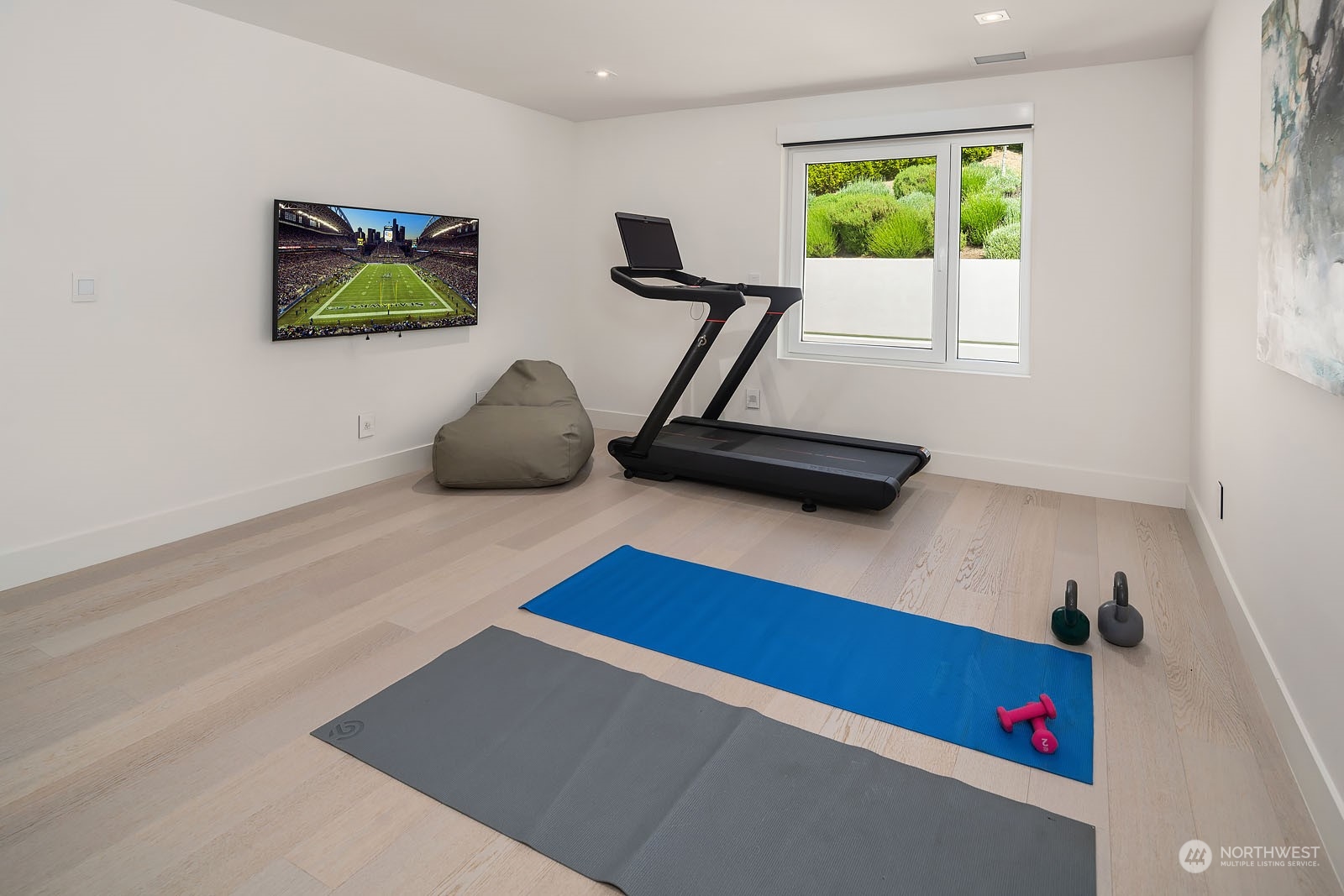 3225 Evergreen Point Road Medina, WA 98039 - Photo 15 of 34 a room with gym equipment and a window